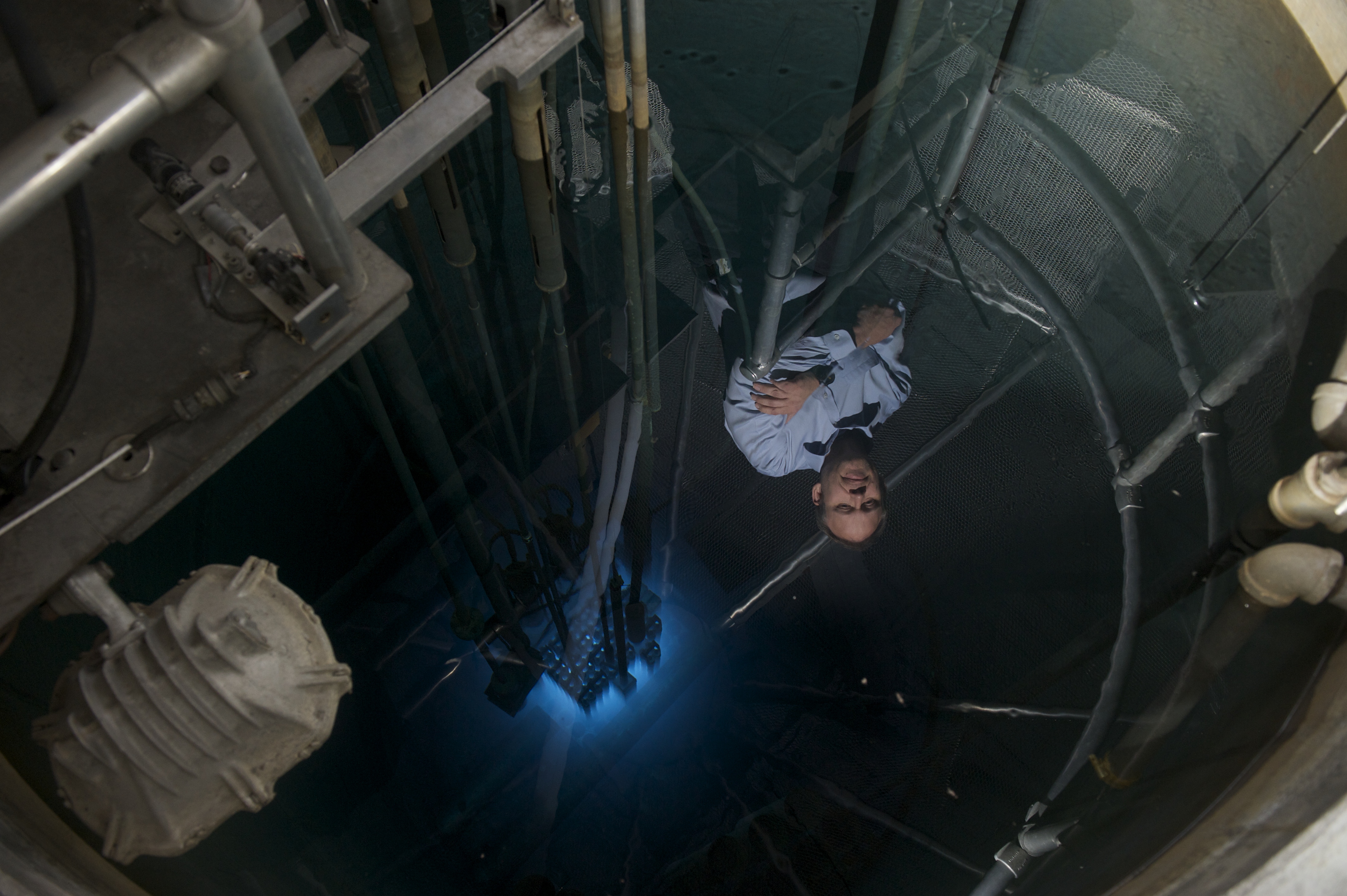 Tim reflecting upon the neutron production within the operating UMD Nuclear Reactor Tims reflection in the UMD Nuclear Reactor Pool
