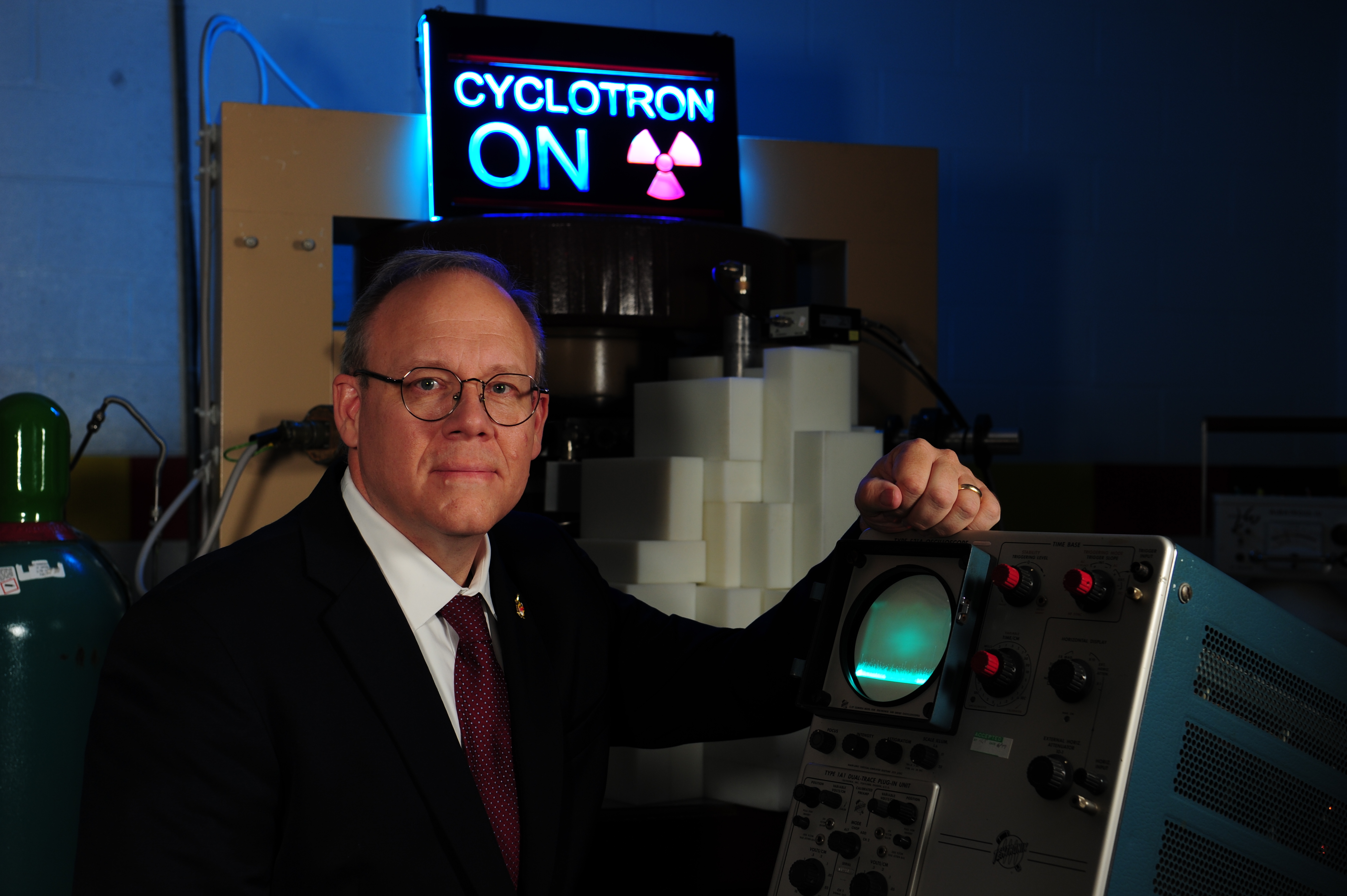 Tim in front of his cyclotron